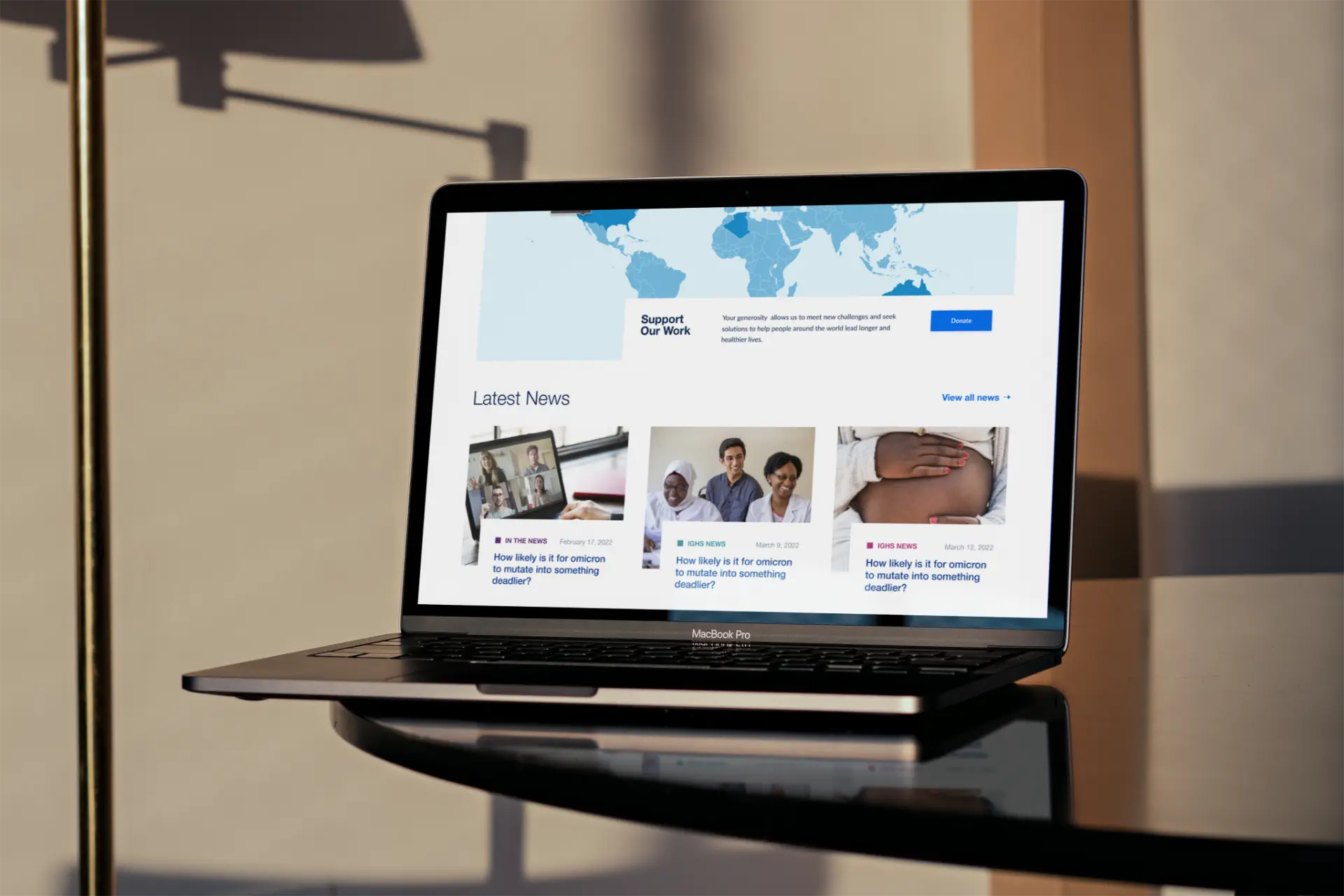 Redesigned UCSF IGHS homepage news section shown on a laptop.