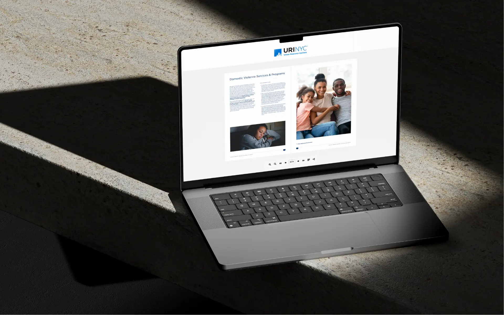 URI annual report digital edition open on a laptop.